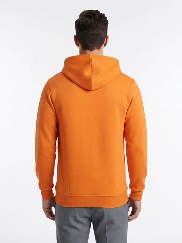 AI model wearing the orange hoodie, side view